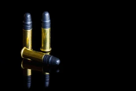 Three small caliber .22 bullets. Stock Photos