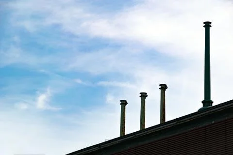 Three small chimneys on a rooftop Foto stock