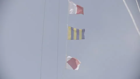 Three small flags waving in the wind on a boat 스톡 동영상 326067752