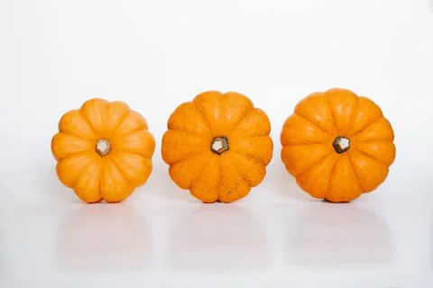 Three small pumpkins Stock Photos