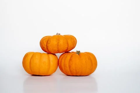 Three small pumpkins Stock Photos