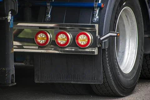Three small round headlights next to the rear wheels of the truck Photos