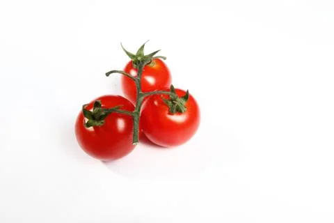 Three small tomatoes Foto stock