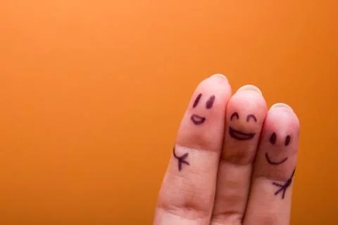 Three smiling fingers that are very happy to be friends Stock Photos