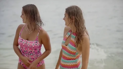 Three smiling friends enjoying a weekend on the beach in Bali Stock Footage 71554232
