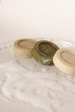 Three soap solid bars on light background. 스톡 사진