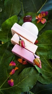 Three soaps of different essential oil fragrances for spa treatment Stock Photos
