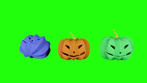 Three Soft Rubber Halloween Pumpkins Is Slowly Falling Bouncing On Green Screen. Stock-Footage 347125889