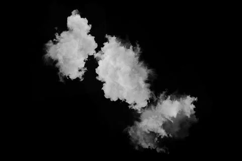 Three soft white clouds floating against solid black background element Stock Photos