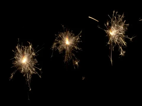 Three Sparklers Burn at Once Stock Footage 75900550