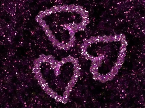 Three Sparkling Purple Glitter Hearts on Black Background Stock Footage 327290912