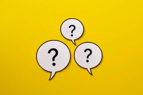 Three speech bubbles with question marks a bright yellow background 스톡 사진