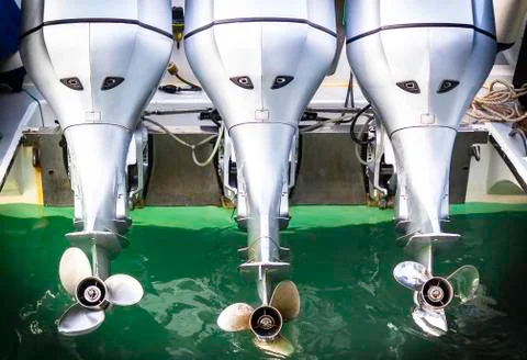 Three speed boat engine with propeller Stock Photos