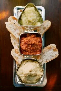 Three spicy dips with white bread Stock Photos