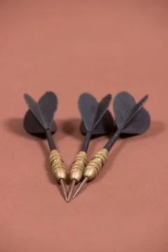 Three spiked black darts Stock Photos
