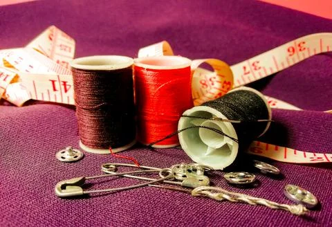 Three spools with multicolored threads Stock Photos
