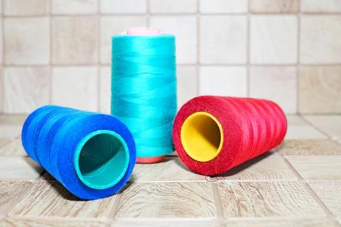 Three spools of thread. Navy, red and blue Stock Photos