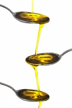 Three spoons with olive oil. Stock Photos