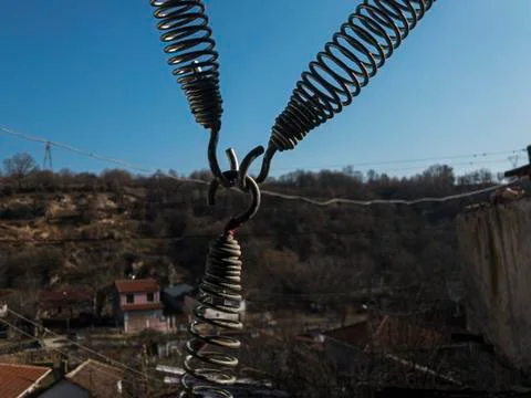 Three springs intersect at a single point Stock Photos