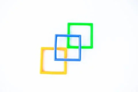 Three square shaped plastic with different color isolated on a white backgrou Stock Photos