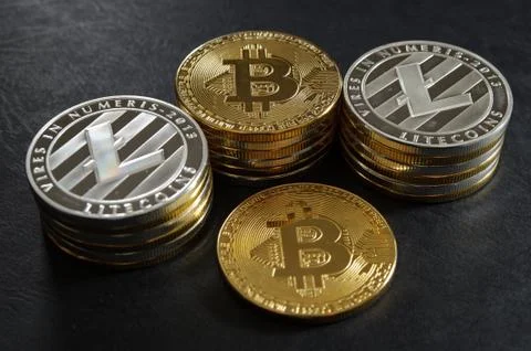 Three stack of cryptocurrency coins with single bitcoin Stock Photos