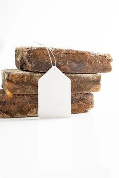Three stacked rustic, weathered bricks on a white background with a blank w.. Stock Photos