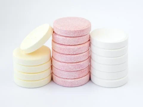 Three stacks of different effervescent vitamins. Nutritional supplements. Stock Photos