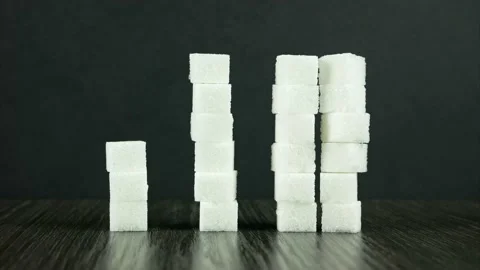 Three stacks of sugar cubes, from small to large. Different amounts of sugar Stock-Footage 154659334
