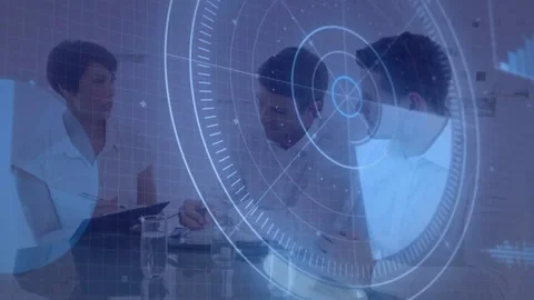 Three staff reviewing documents with HUD appearing, center writing, right Stock Footage 332901819