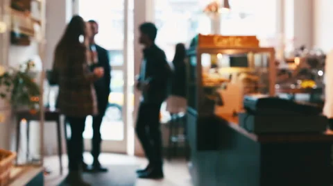 Three Standing Friends Talking in Café Defocused Stock Footage 59785239