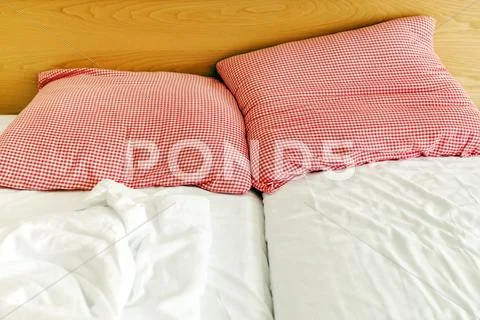 Three star hotel bed and pillows Stock Photos