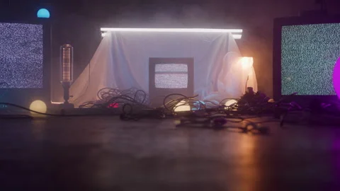 Three Static Televisions in Studio with Wires and Lighting Spread All Over Floor Stock Footage 270334586