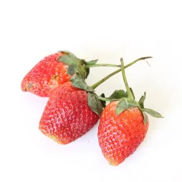 Three stawberries on the white background 스톡 사진