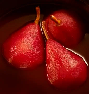 Three stewed pears in a pot Stock Photos