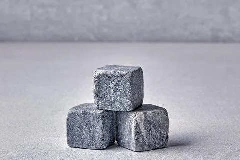 Three stone cubes on a gray concrete background. Backdrop template for product 스톡 사진