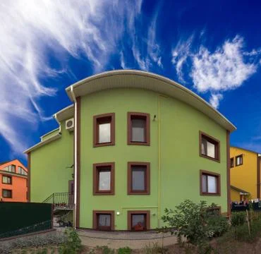 A three-storey house with a backyard Stock Photos