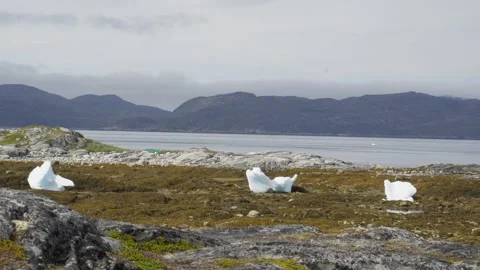 Three Stranded Icebergs on Rocky Coast Near Nuuk Greenland 4K Stock Footage 345518382