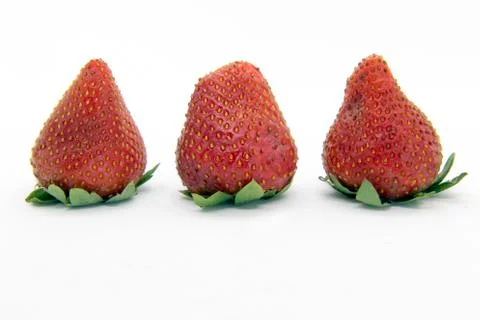 Three strawberries close up Stock Photos