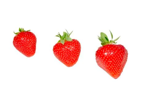 Three strawberries isolated Stock Photos