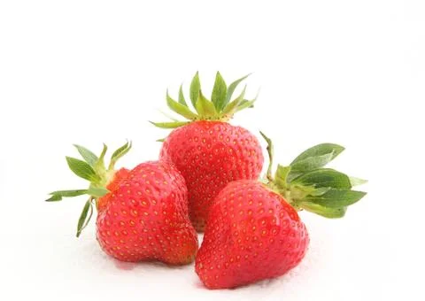 Three strawberries Stock Photos