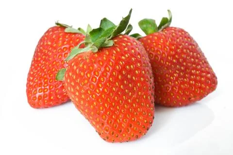 Three strawberries Stock Photos