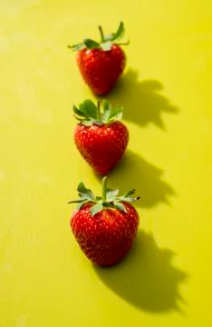 Three strawberries Stock Photos