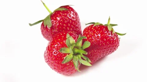 Three strawberries with strawberry leaf on white background. Stock Footage 276891682