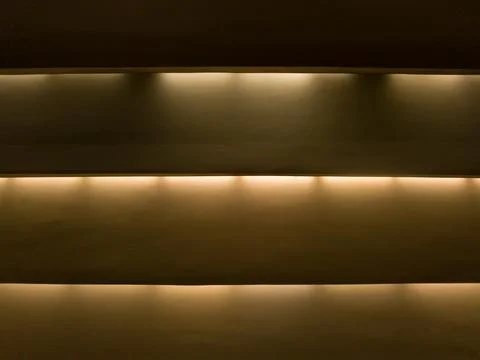 Three strips with top warm cornice lighting, background. Stock Photos