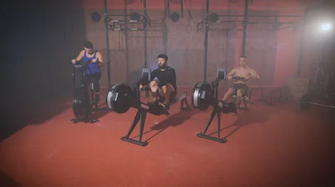Three strong men doing crossfit training at the gym Stock Footage 68668838