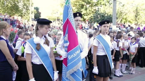 Three student with flag. School. First Grade. 1 September Stock Footage 67587572