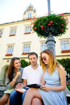 Three students are preparing for exams. Stock Photos