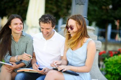 Three students are preparing for exams. Stock Photos