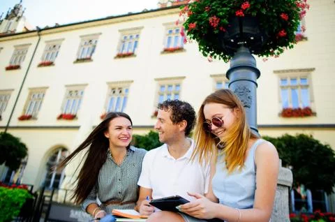 Three students are preparing for exams. Stock Photos