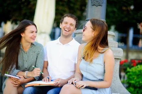 Three students are preparing for exams. Stock Photos